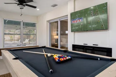 Challenge friends to a game of pool while catching the big game on the large flat-screen TV in this stylish entertainment room. With indoor-outdoor access, comfy seating, and plenty of space to unwind, fun nights are guaranteed!