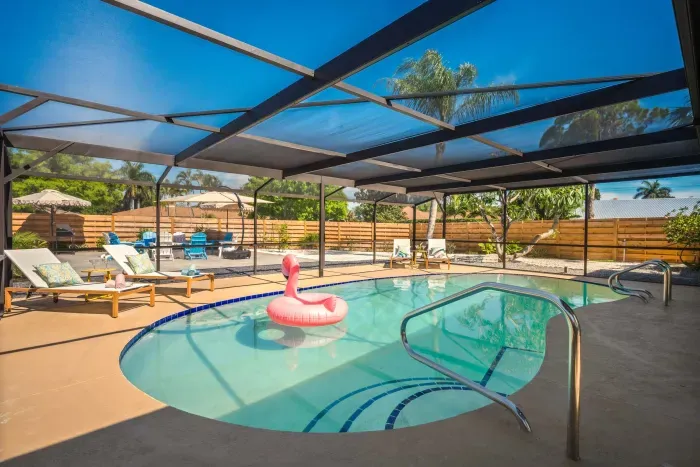 Dive into vacation mode in this sparkling screened-in pool oasis! Lounge under the shade, float the day away, or enjoy peaceful outdoor vibes with plenty of seating, sunshine, and privacy—perfect for relaxing family getaways.