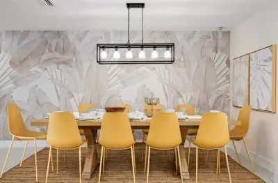 Gather for memorable meals in this beautifully designed dining space featuring modern lighting, stylish seating, and elegant tropical-inspired décor. Perfect for family dinners, celebrations, or enjoying takeout after a day in the sun.