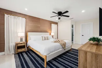 Retreat to this peaceful and stylish bedroom featuring a cozy king bed, warm wood accents, blackout curtains, and modern décor. Designed for comfort and relaxation, it’s the perfect place to recharge after a fun-filled day.