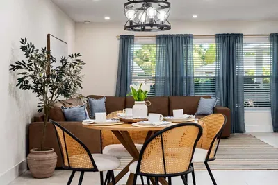 Relax and reconnect in this beautifully styled living and dining space featuring cozy seating, natural light, and elegant modern décor. Perfect for morning coffee, family meals, or winding down after a fun-filled day in paradise.