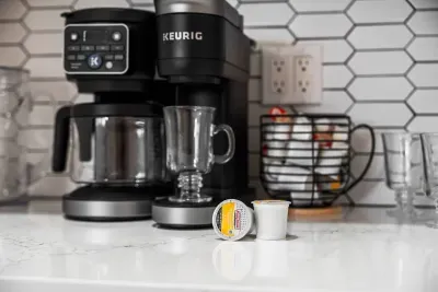 Wake up and brew your favorite coffee with the convenient Keurig station, fully stocked for easy mornings. Enjoy fresh coffee in this modern kitchen space before heading out for another relaxing day in paradise.