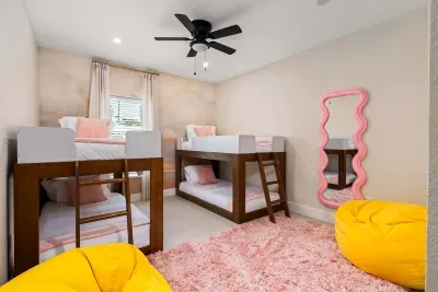 Kids will love this fun and colorful bunk room featuring cozy beds, playful décor, soft rugs, and a stylish mirror for getting ready. Designed for comfort and fun, it’s the perfect space for sleepovers, games, and making vacation memories together.