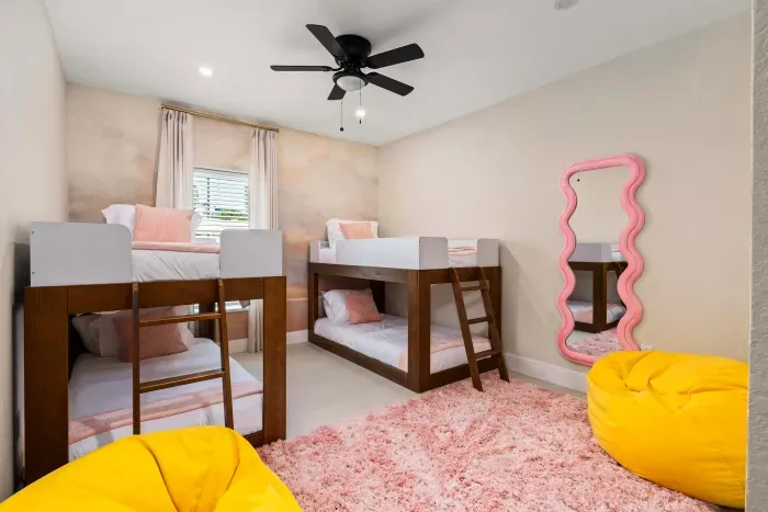 Kids will love this fun and colorful bunk room featuring cozy beds, playful décor, soft rugs, and a stylish mirror for getting ready. Designed for comfort and fun, it’s the perfect space for sleepovers, games, and making vacation memories together.