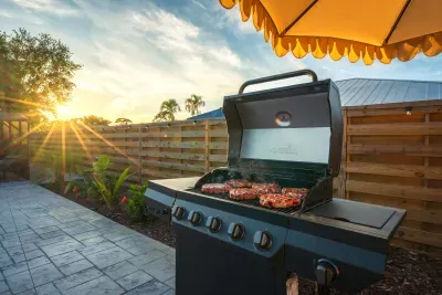 Fire up the grill and enjoy outdoor dining in this beautiful backyard BBQ space. Cook up your favorites while soaking in the sunset views, tropical landscaping, and relaxed vacation vibes—perfect for family meals and evening gatherings.