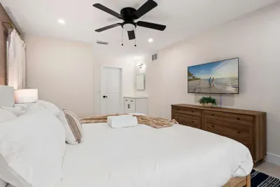 Kick back and relax in this spacious bedroom retreat featuring a plush king bed, modern furnishings, and a large TV for cozy nights in. Thoughtfully designed with comfort and style in mind, it’s the perfect space to recharge during your stay.