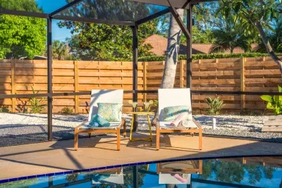 Relax poolside in this peaceful tropical retreat featuring shaded lounge seating, privacy fencing, and serene outdoor vibes. Perfect for morning coffee, afternoon sunbathing, or unwinding after a fun-filled day in paradise.