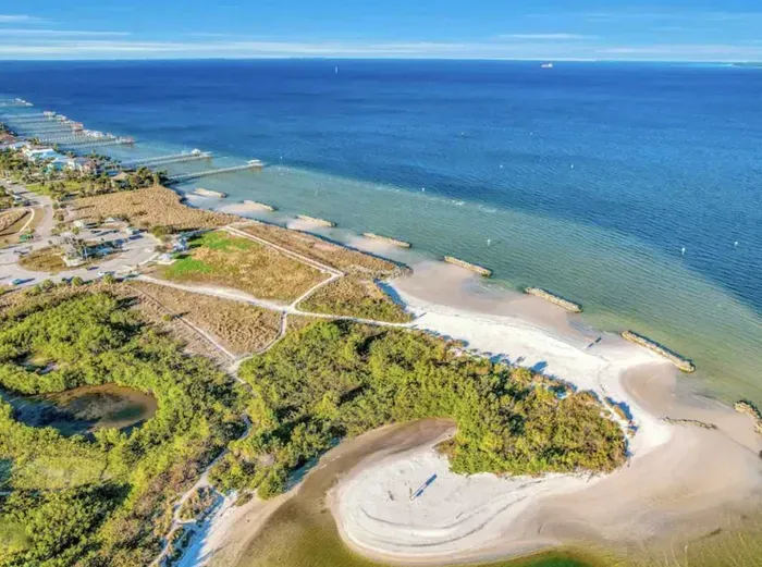 Stunning aerial view of Apollo Beach’s pristine shoreline and crystal-blue waters. Perfect for nature lovers and beachgoers seeking tranquility, scenic trails, and breathtaking coastal beauty.