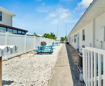 The shared BBQ area has charcoal grills and picnic tables for added enjoyment
