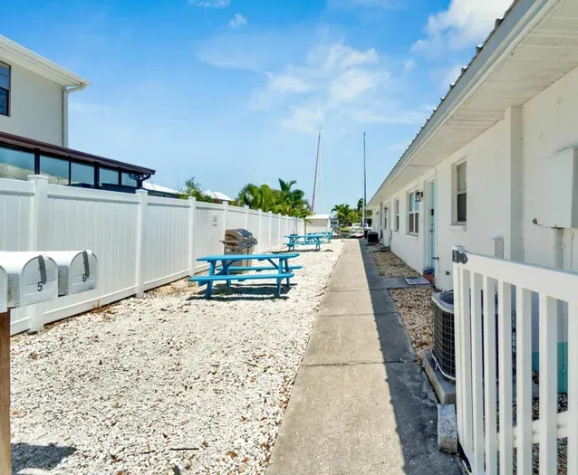 The shared BBQ area has charcoal grills and picnic tables for added enjoyment