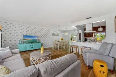 Step into this bright and airy coastal-themed living, where relaxation meets elegance. With its inviting decor, natural light, and beach-inspired accents, this space is perfect for unwinding or hosting gatherings with family and friends