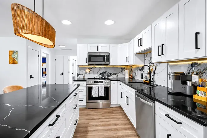Full-length prep counter, dedicated coffee bar stocked with K-cups, under-cabinet lighting, deep sink for the big pans — the kitchen actually works when you're cooking for ten.