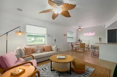 Open-concept living space with chic décor, cozy seating, and warm natural light. Enjoy stylish furnishings, modern kitchen flow, and inviting vibes—perfect for relaxing, entertaining, or making yourself feel right at home.
