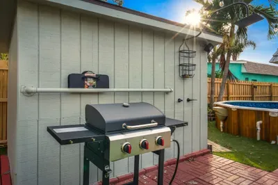 Fire up the grill in this private backyard cookout zone, just steps from the hot tub. Perfect for sunny lunches or evening BBQs, this space makes outdoor dining easy, fun, and a highlight of your stay.