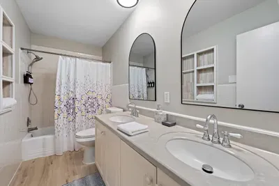 Guest bathroom with shower and bathtub