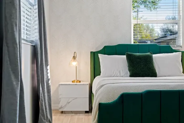 Bedroom with Queen bed, TV, and ensuite bathroom.