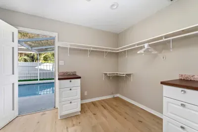 Primary closet/dressing room next to the pool