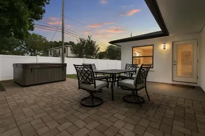 Outdoor furniture next to the hot tub to enjoy evenings with your loved ones!