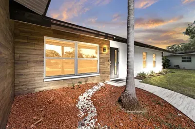 Step into your home away from home! This lovely property features a well-maintained exterior, with thoughtful landscaping and a welcoming entrance that sets the tone for a relaxing stay.