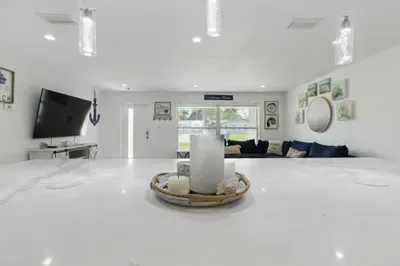 This open layout creates a perfect flow for conversation and connection, whether you're cooking, entertaining, or simply relaxing at home.