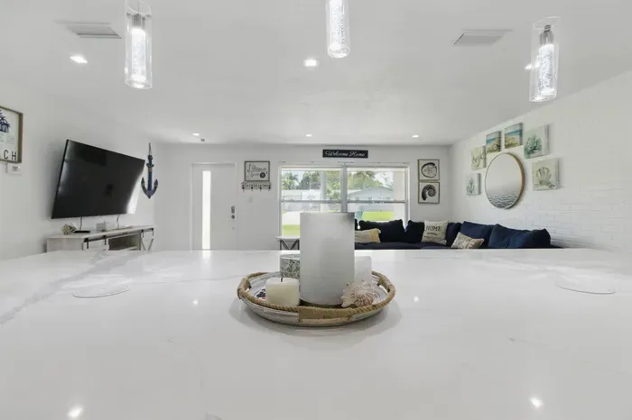 This open layout creates a perfect flow for conversation and connection, whether you're cooking, entertaining, or simply relaxing at home.