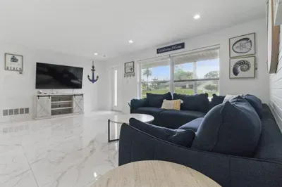 Kick back and relax in this cozy living room, complete with a comfy sofa and a flat-screen smart TV—perfect for movie nights, streaming your favorite shows, or unwinding after a day out. The space is designed for comfort and connection.