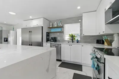 The open layout and clean design make it easy to cook, dine, and feel right at home.