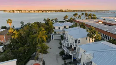 Beautiful coastal community surrounded by palm trees and waterfront views. Enjoy peaceful evenings, gentle breezes, and tropical charm just moments from the beach.