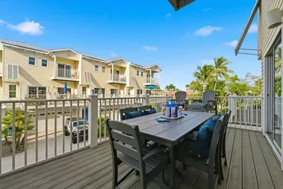 Enjoy open-air dining on this sunny private balcony with seating for six. Perfect for breakfast under blue skies or evening cocktails surrounded by palm trees and fresh coastal air.