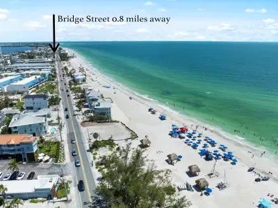 Walk or bike to local shops, dining, and entertainment while enjoying stunning Gulf views and easy beach access right outside your door.