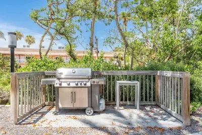 Enjoy outdoor cooking in this serene grilling area surrounded by tropical greenery. Perfect for family barbecues or sunset dinners after a relaxing day at the beach.