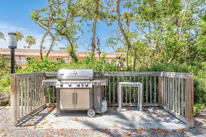 Enjoy outdoor cooking in this serene grilling area surrounded by tropical greenery. Perfect for family barbecues or sunset dinners after a relaxing day at the beach.