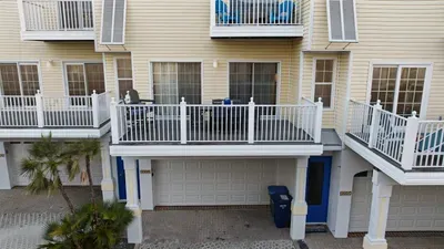 Spacious balcony perfect for morning coffee or evening cocktails with a sea breeze. Enjoy outdoor seating, sunny views, and coastal charm just steps from the beach.