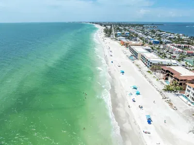 Crystal-clear turquoise waters and soft white sands stretch for miles along this breathtaking Gulf Coast shoreline—perfect for swimming, sunbathing, and soaking in endless ocean views.