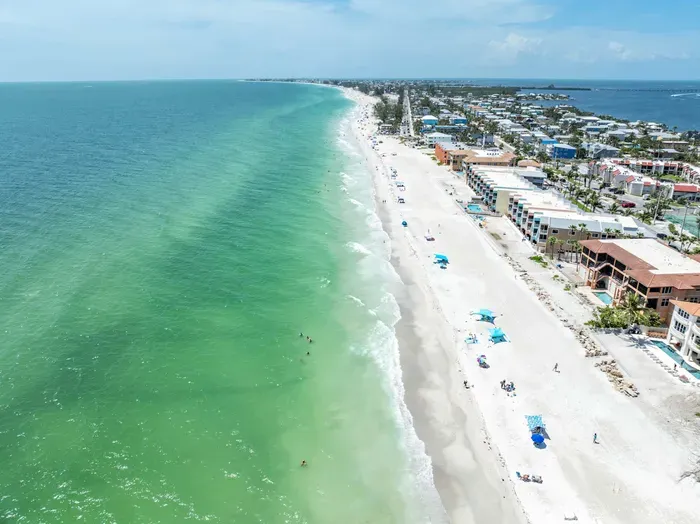 Crystal-clear turquoise waters and soft white sands stretch for miles along this breathtaking Gulf Coast shoreline—perfect for swimming, sunbathing, and soaking in endless ocean views.