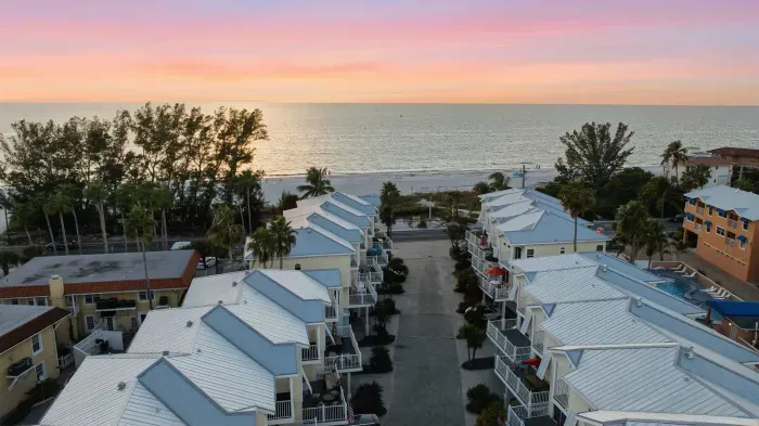 Breathtaking sunset over the Gulf shines above this peaceful beachfront community. Just steps from the sand, enjoy ocean breezes, pastel skies, and the ultimate coastal escape.