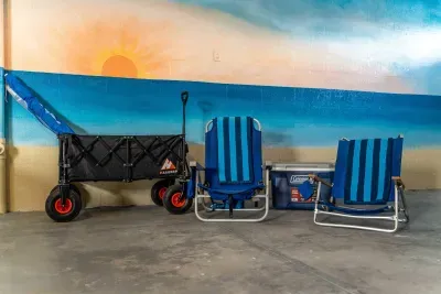 Beach days made easy with complimentary chairs, a cooler, and a wagon for your gear. Everything you need for a relaxing day by the ocean—just pack up and stroll to the shore in minutes!