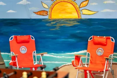 Relax and unwind in this fun beach-inspired game room 🌴☀️ Kick back between games while soaking in the colorful coastal vibes — the perfect hangout spot for family fun and unforgettable vacation memories!