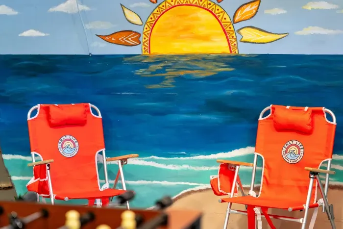 Relax and unwind in this fun beach-inspired game room 🌴☀️ Kick back between games while soaking in the colorful coastal vibes — the perfect hangout spot for family fun and unforgettable vacation memories!