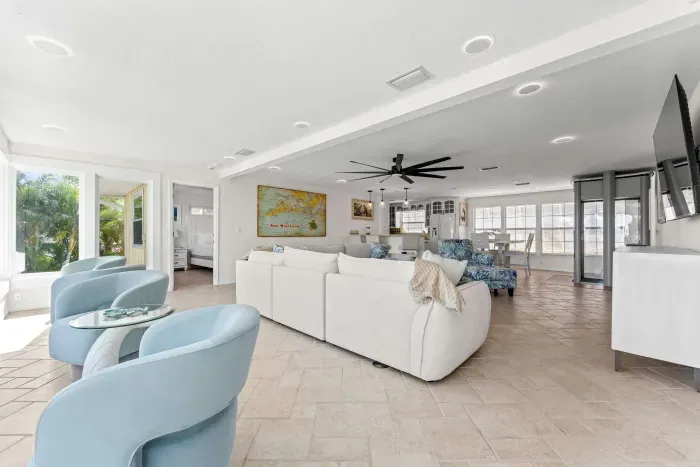 Open-concept coastal living. Enjoy a bright, spacious layout with comfortable seating, tropical views, and plenty of room to gather with family and friends. Perfect for relaxing, entertaining, and making lasting vacation memories!