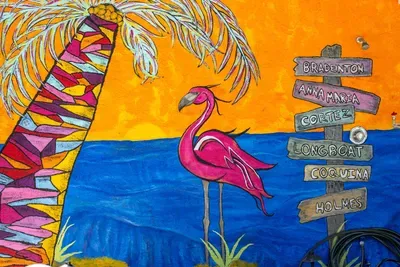 Colorful coastal mural full of island charm. This vibrant artwork captures the fun, tropical spirit of Anna Maria Island and adds the perfect beachy touch to your unforgettable Florida getaway!