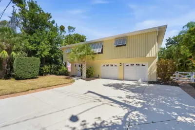 Spacious private driveway and tropical island retreat. Enjoy easy parking, peaceful surroundings, and a relaxing waterfront getaway just minutes from the beautiful beaches of Anna Maria Island!