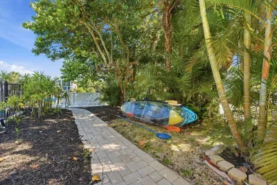 Tropical backyard oasis 🌴☀️ Enjoy a peaceful outdoor space surrounded by lush palms, perfect for relaxing walks, morning coffee, or unwinding after a fun day exploring the beautiful Florida coast!