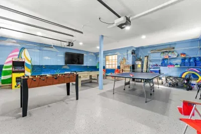 Large game room built for nonstop fun. Enjoy ping pong, foosball, arcade games, and plenty of space for family and friends to relax, play, and make unforgettable vacation memories together!