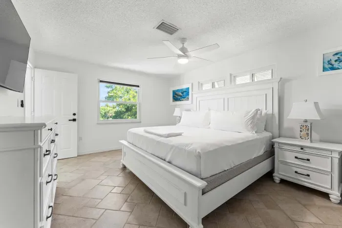 Featuring a cozy bed, relaxing atmosphere, and plenty of natural light — the perfect retreat after a fun day at the beach or on the water!