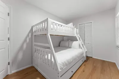 Cozy bunk room with trundle bed. Perfect for kids, friends, or extra guests, this fun and comfortable space offers extra sleeping room for relaxing after a day at the beach, pool, or island adventures!
