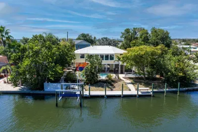 Waterfront island paradise with a private dock. Enjoy direct canal access, peaceful water views, and the perfect tropical retreat for boating, relaxing poolside, and making unforgettable Florida vacation memories!