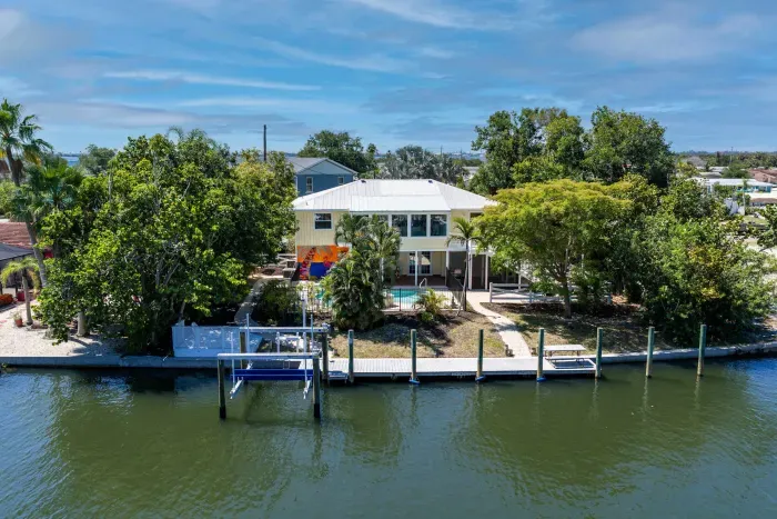 Waterfront island paradise with a private dock. Enjoy direct canal access, peaceful water views, and the perfect tropical retreat for boating, relaxing poolside, and making unforgettable Florida vacation memories!