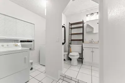 Convenient laundry and bathroom area ✨🧺🚿 Enjoy the added comfort of in-home laundry and a clean, refreshing bathroom space — perfect for longer stays, beach days, and relaxing Florida getaways!