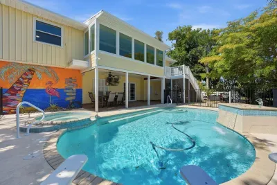Private tropical pool retreat. Relax by the sparkling pool, soak up the Florida sunshine, and enjoy the perfect waterfront getaway for unforgettable family vacations and relaxing island escapes!